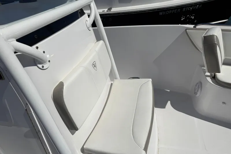 Slide: The Image of 2023 Century 2600 Center Console boat interior with white seating and console details. - 7