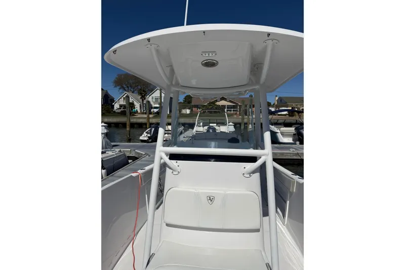 Slide: The Image of 2023 Century 2600 Center Console boat docked, showcasing sleek design and spacious layout. - 8