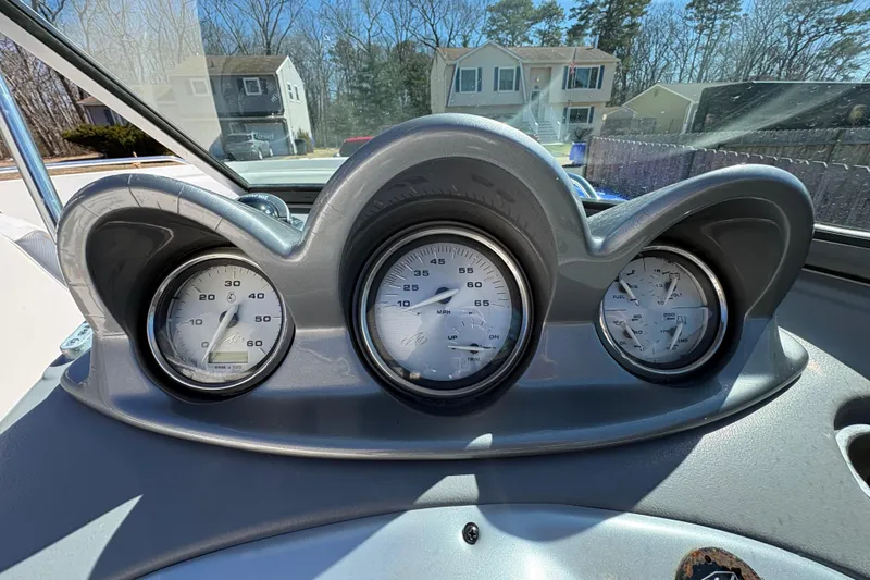 Slide: The Image of Dashboard of a 2009 Monterey 214FS boat with gauges and controls. - 3