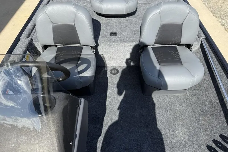 Slide: The Image of 2026 Tracker Bass Tracker Classic XL interior with gray seating and steering wheel. - 10