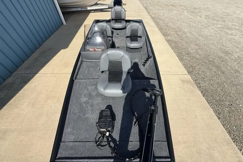 Slide: The Image of 2026 Tracker Bass Tracker Classic XL boat with gray seating and trolling motor. - 19