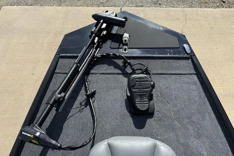 Slide: The Image of 2026 Tracker Bass Tracker Classic XL boat deck with trolling motor and foot pedal. - 3