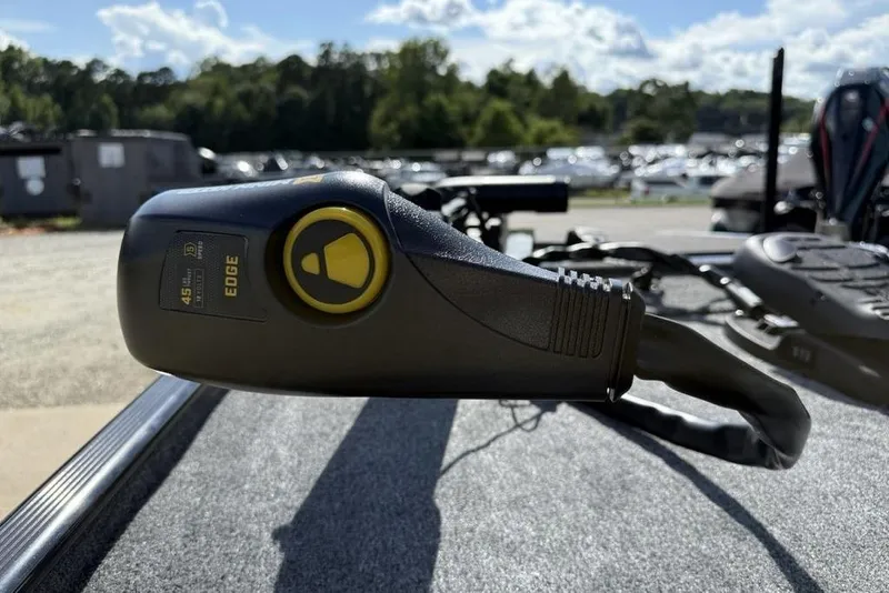 Slide: The Image of Trolling motor on 2026 Tracker Bass Tracker Classic XL boat, outdoors in a sunny setting. - 7