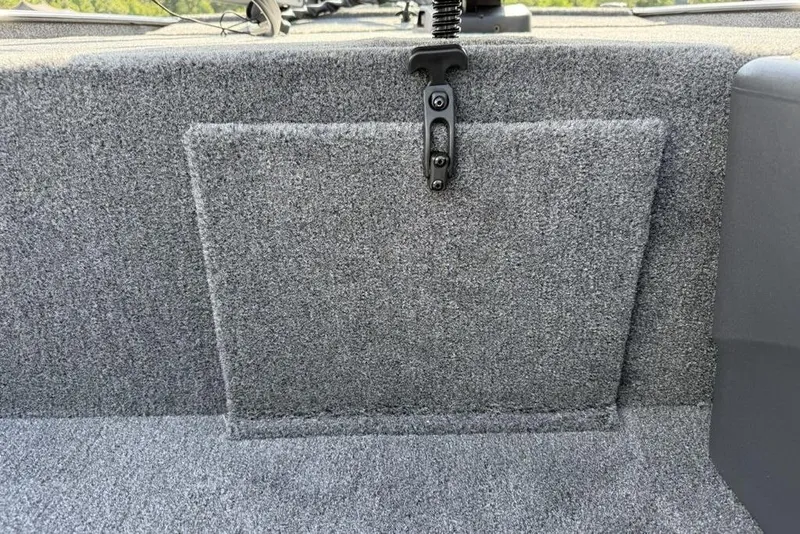 Slide: The Image of 2026 Tracker Bass Tracker Classic XL interior with gray carpeted storage compartment. - 8