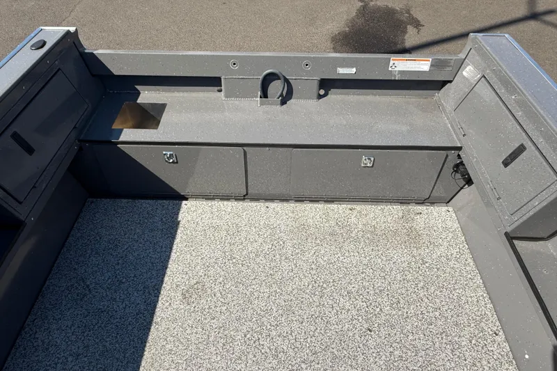 Slide: The Image of 2025 Alumaweld Free Drifter 20 boat interior with storage compartments and textured flooring. - 16
