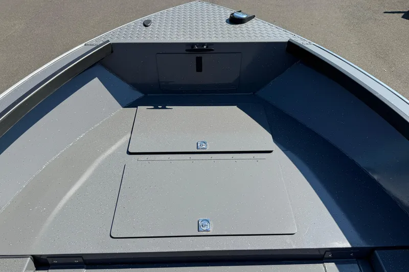 Slide: The Image of 2025 Alumaweld Free Drifter 20 boat interior, featuring storage compartments and sleek design. - 26