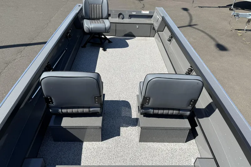 Slide: The Image of 2025 Alumaweld Free Drifter 20 boat interior with three gray seats on a textured floor. - 27