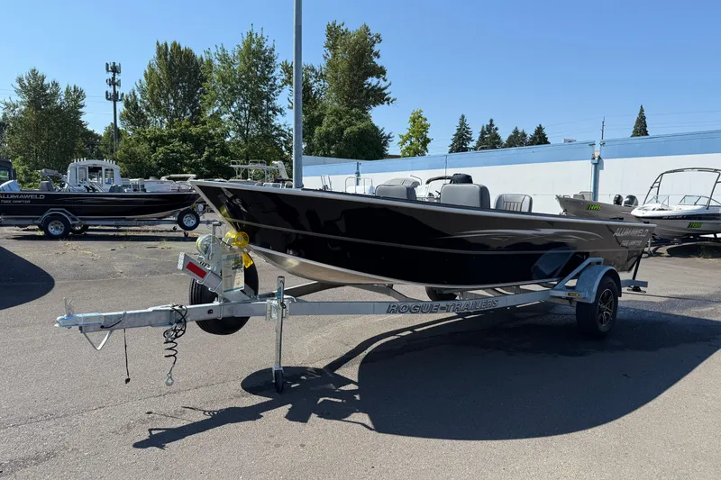 Slide: The Image of 2025 Alumaweld Free Drifter 20 boat on trailer in outdoor dealership lot. - 3