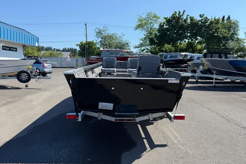 Slide: The Image of 2025 Alumaweld Free Drifter 20 boat, rear view in a dealership lot. - 4