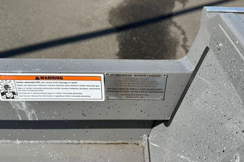 Slide: The Image of 2025 Alumaweld Free Drifter 20 boat warning labels and capacity specifications. - 9