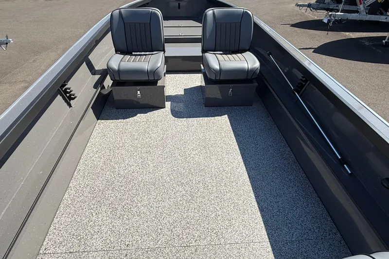 Slide: The Image of 2025 Alumaweld Free Drifter 20 boat interior with two gray seats and spacious deck. - 17