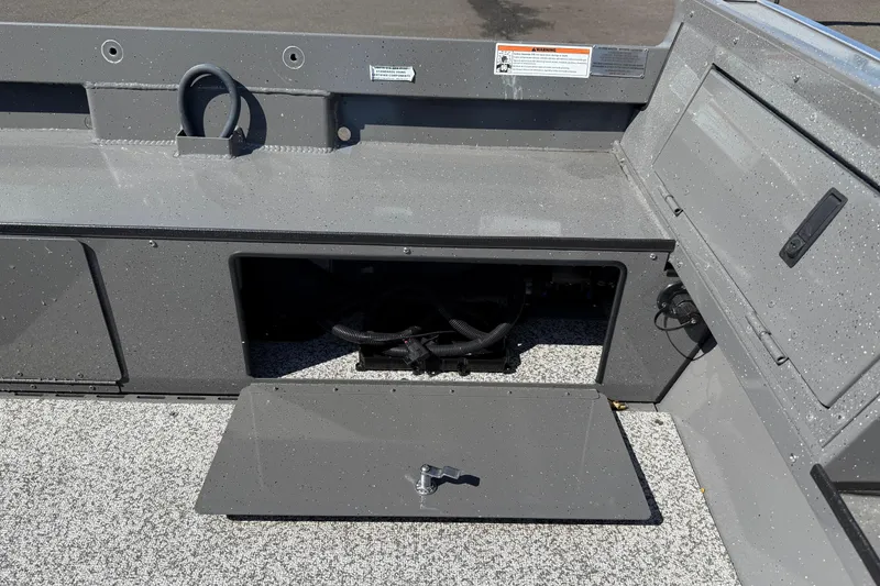 Slide: The Image of 2025 Alumaweld Free Drifter 20 boat interior storage compartment with open hatch. - 7