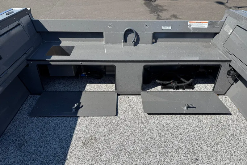 Slide: The Image of 2025 Alumaweld Free Drifter 20 boat interior with open storage compartments. - 8