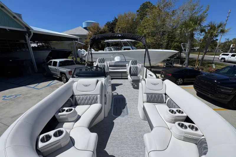 Slide: The Image of 2026 Bennington 22 LXS Swingback pontoon boat with luxurious seating and cup holders. - 18