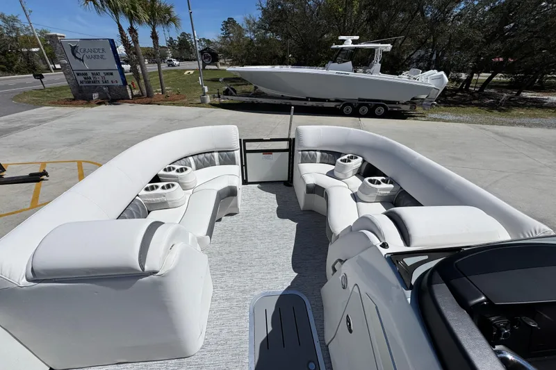 Slide: The Image of 2026 Bennington 22 LXS Swingback boat with luxurious seating and cup holders. - 21