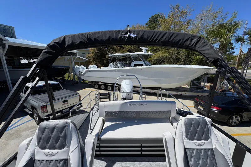 Slide: The Image of 2026 Bennington 22 LXS Swingback pontoon boat with luxurious seating and sleek design. - 28