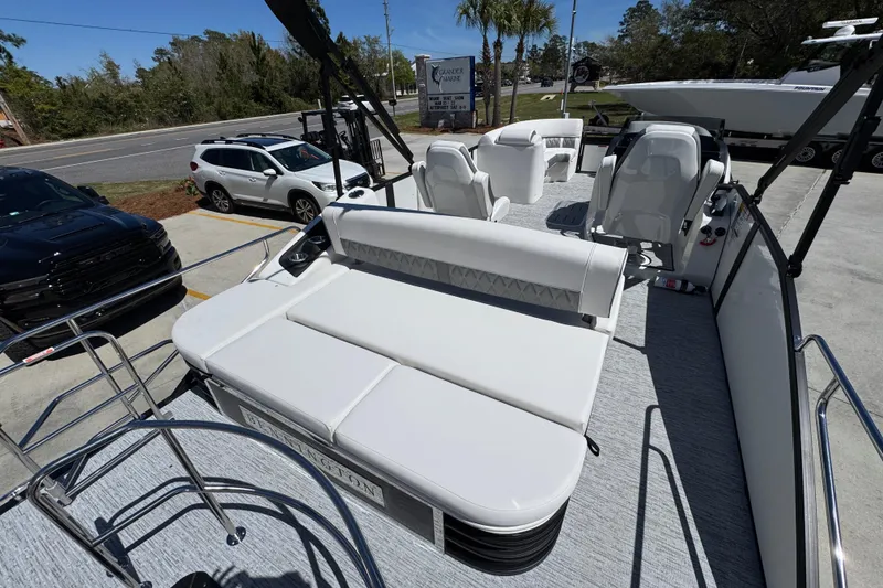 Slide: The Image of 2026 Bennington 22 LXS Swingback pontoon boat with luxurious seating and modern design. - 32