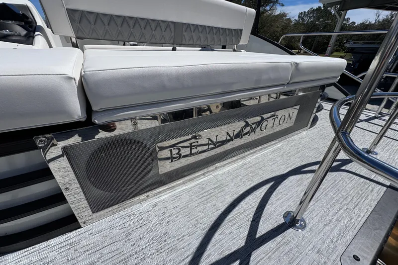 Slide: The Image of 2026 Bennington 22 LXS Swingback boat with sleek seating and stylish design. - 34