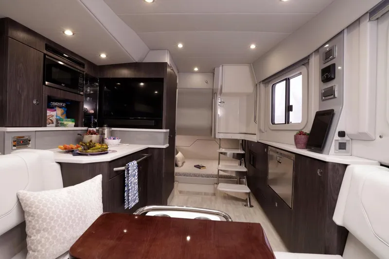 Slide: The Image of Manufacturer Provided Image: 2023 Formula 430 Super Sport Crossover interior, modern kitchen and dining area. - 10