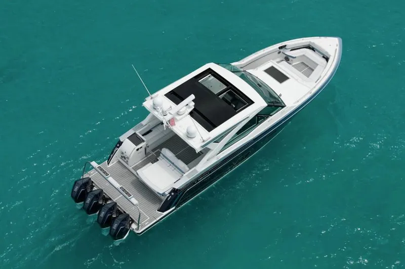Slide: The Image of Manufacturer Provided Image: 2023 Formula 430 Super Sport Crossover luxury boat on turquoise water. - 2