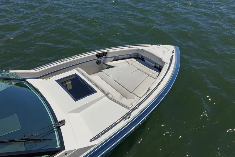 Slide: The Image of 2023 Formula 430 Super Sport Crossover boat on water, featuring spacious seating area. - 23