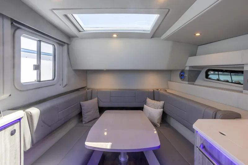 Slide: The Image of Luxurious interior of 2023 Formula 430 Super Sport Crossover yacht with skylight and seating area. - 24