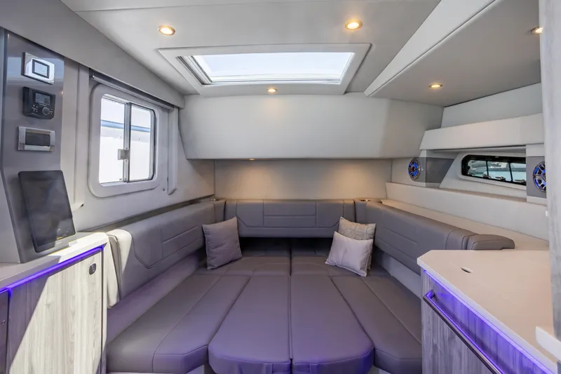 Slide: The Image of Luxurious interior of 2023 Formula 430 Super Sport Crossover yacht with modern seating and skylight. - 25