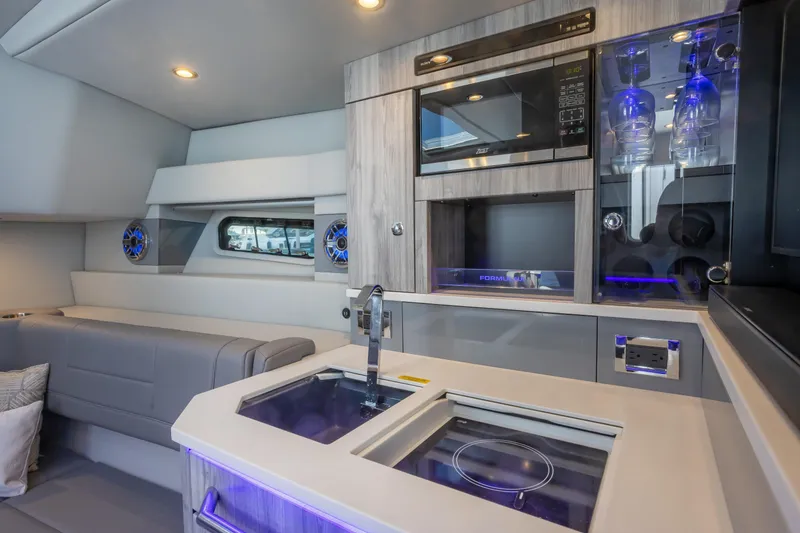 Slide: The Image of Luxurious interior of 2023 Formula 430 Super Sport Crossover yacht with modern kitchen amenities. - 27
