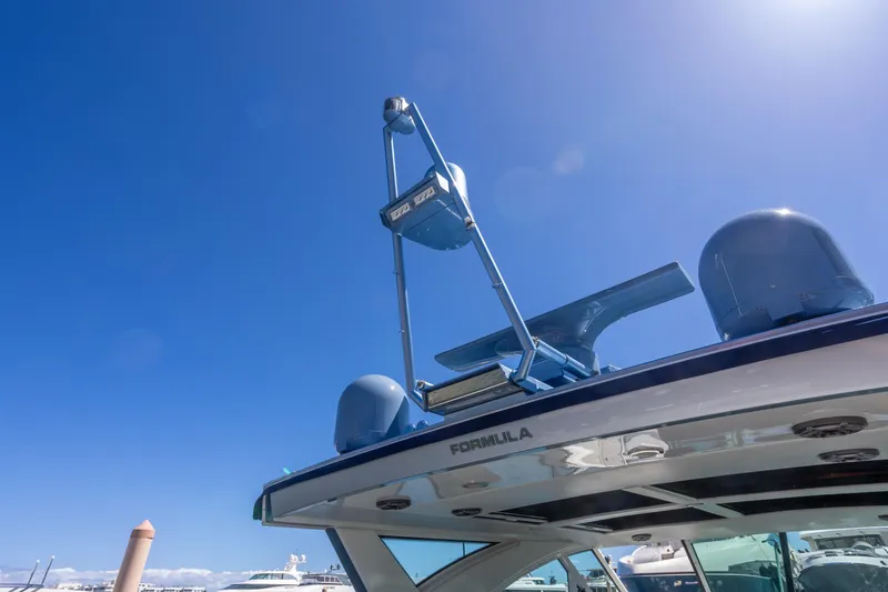 Slide: The Image of 2023 Formula 430 Super Sport Crossover yacht under clear blue sky. - 30