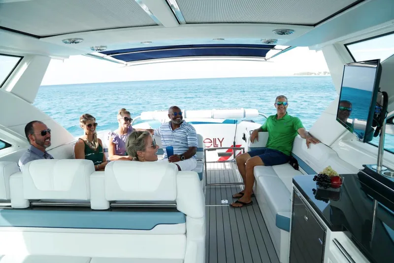 Slide: The Image of Manufacturer Provided Image: 2023 Formula 430 Super Sport Crossover yacht with people relaxing on deck. - 9
