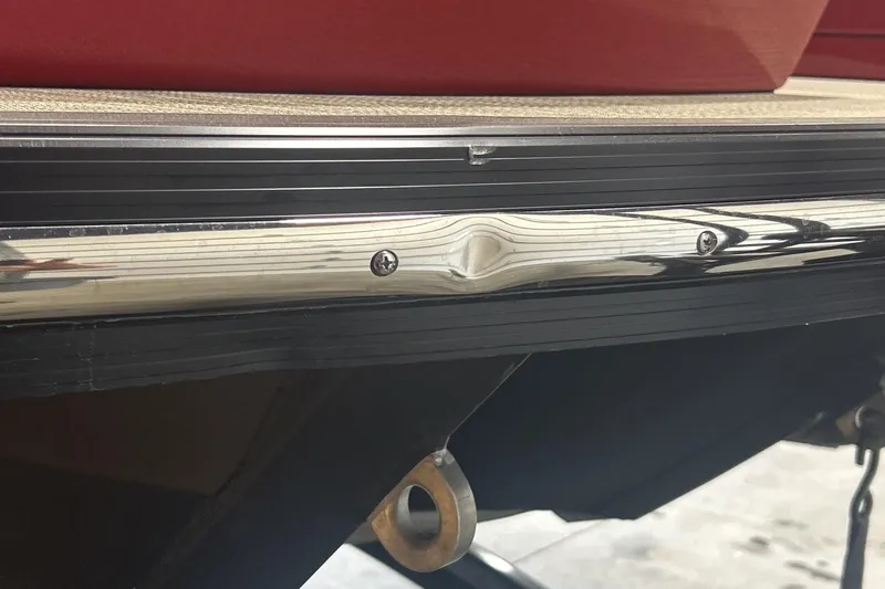 Slide: The Image of 2023 Montara 25 Surf Boss 2.0 CW boat with dented metal trim detail. - 13