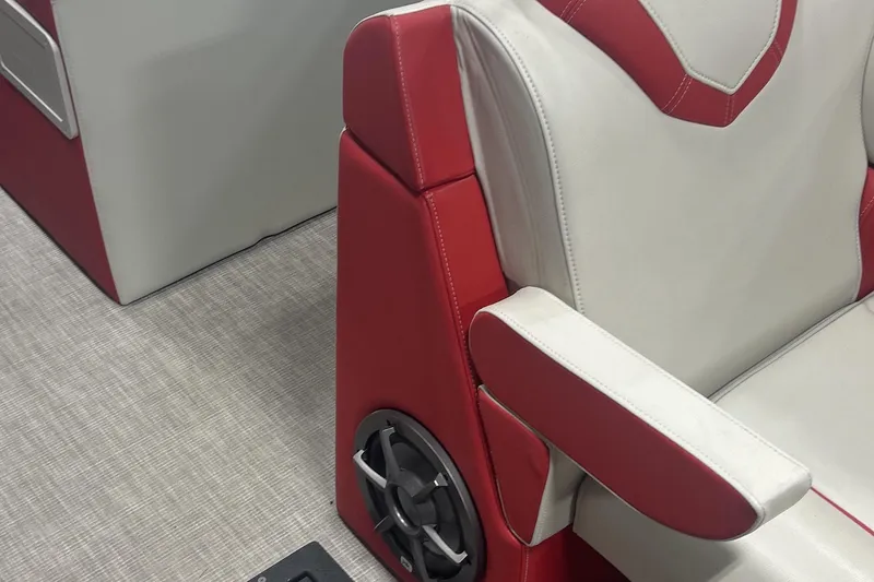 Slide: The Image of Red and white seating with speaker detail in 2023 Montara 25 Surf Boss 2.0 CW boat. - 16
