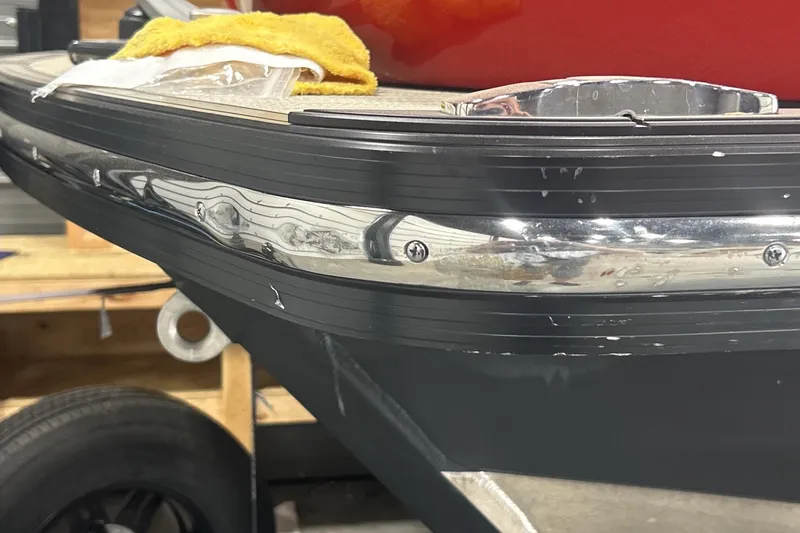 Slide: The Image of 2023 Montara 25 Surf Boss 2.0 CW boat detail with chrome trim and deck. - 18