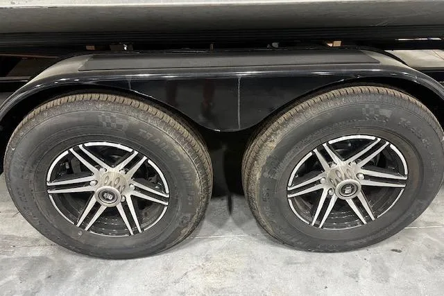 Slide: The Image of 2023 Montara 25 Surf Boss 2.0 CW trailer wheels, featuring dual tires and sleek rims. - 25