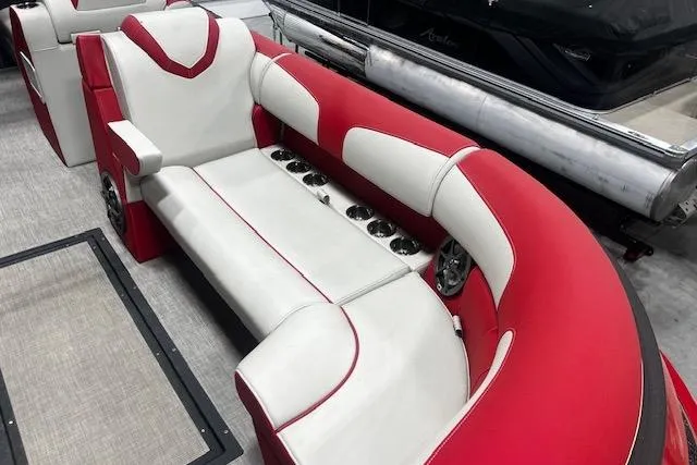 Slide: The Image of 2023 Montara 25 Surf Boss 2.0 CW boat interior with red and white seating. - 6