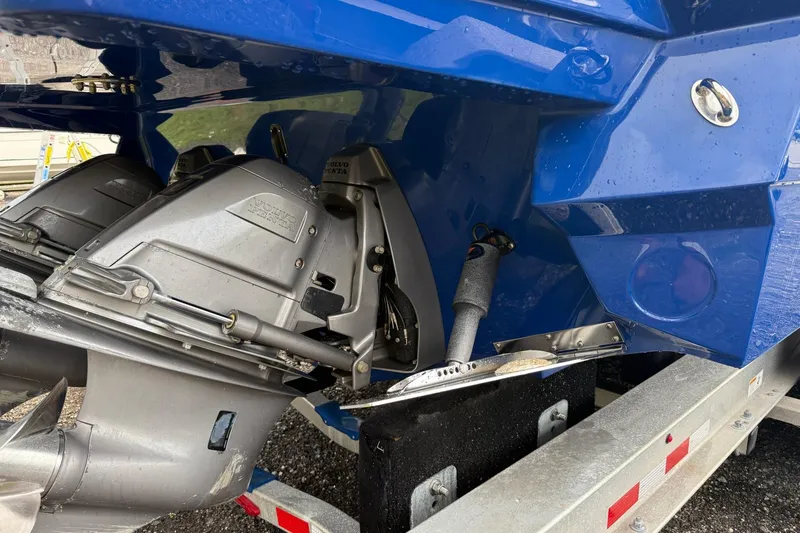 Slide: The Image of 2019 Monterey 328SS Super Sport boat with Volvo Penta outdrive, blue hull detail. - 14