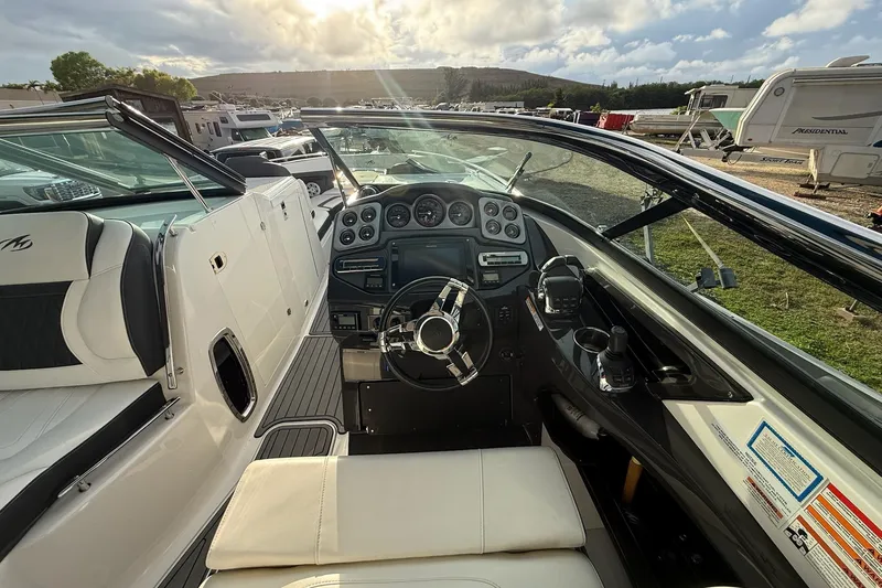 Slide: The Image of 2019 Monterey 328SS Super Sport boat interior with steering wheel and dashboard controls. - 18