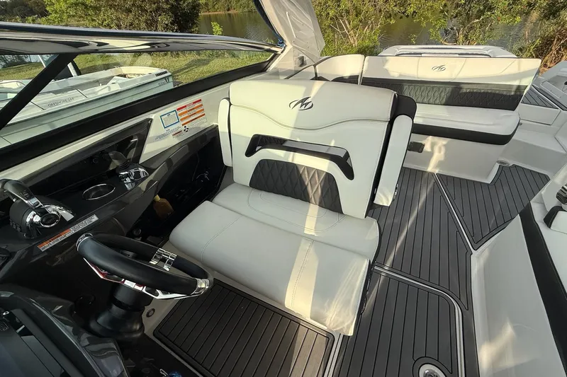 Slide: The Image of 2019 Monterey 328SS Super Sport boat interior with luxurious seating and sleek design. - 19
