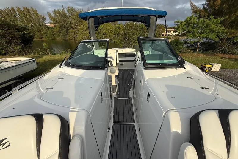Slide: The Image of 2019 Monterey 328SS Super Sport boat with sleek white interior and dual windshields. - 22