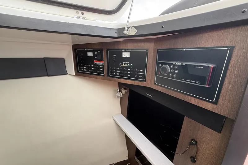 Slide: The Image of Control panel of a 2019 Monterey 328SS Super Sport boat interior. - 24
