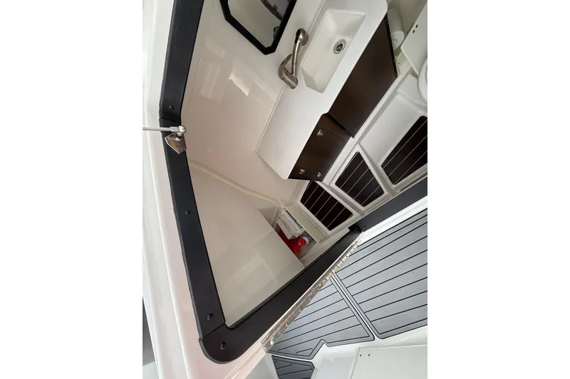 Slide: The Image of 2019 Monterey 328SS Super Sport boat interior with sink and storage cabinets. - 26