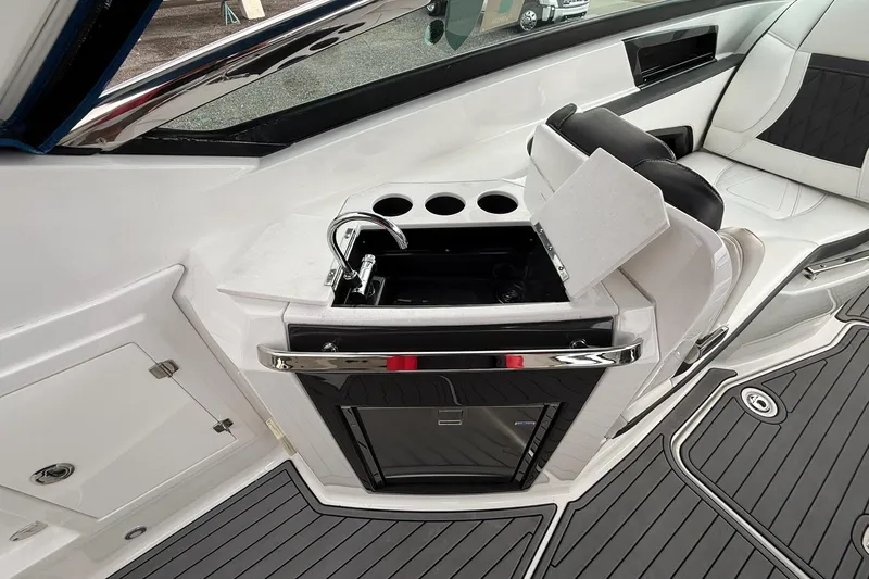Slide: The Image of 2019 Monterey 328SS Super Sport boat interior with sink and seating area. - 27