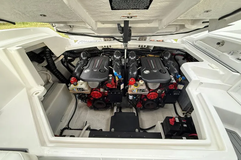Slide: The Image of Engine compartment of a 2019 Monterey 328SS Super Sport boat, showcasing dual engines. - 30