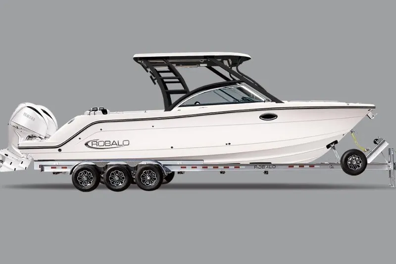 The Image of 2026 Robalo R317 Dual Console boat on trailer, side view. - 0