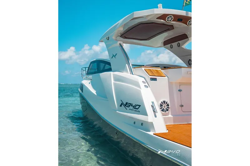 Slide: The Image of 2026 NX Boats NX340 in clear waters, showcasing sleek design and modern features. - 4