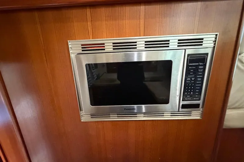 Slide: The Image of Built-in Panasonic microwave in 2005 Riviera 37 Flybridge yacht kitchen. - 12