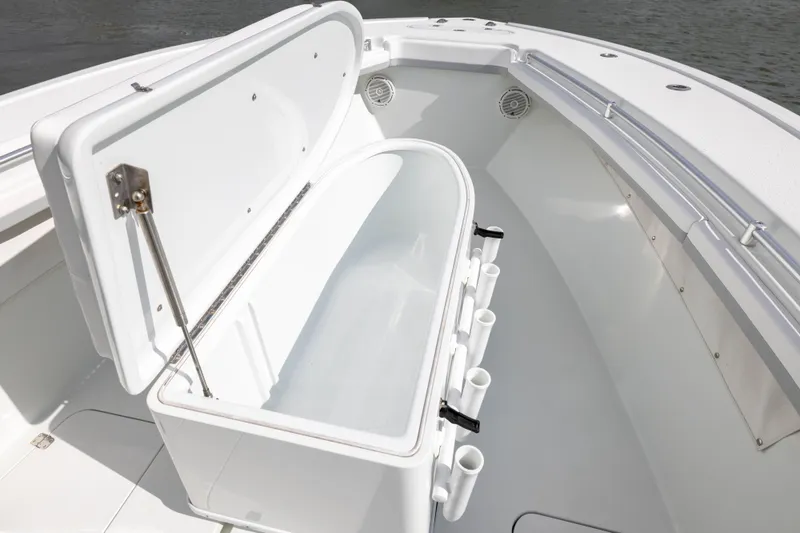 Slide: The Image of 2014 Yellowfin 32 Offshore boat with open storage compartment and rod holders. - 10