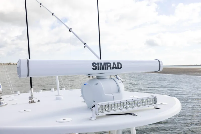 Slide: The Image of Simrad radar on 2014 Yellowfin 32 Offshore boat, ocean background. - 13