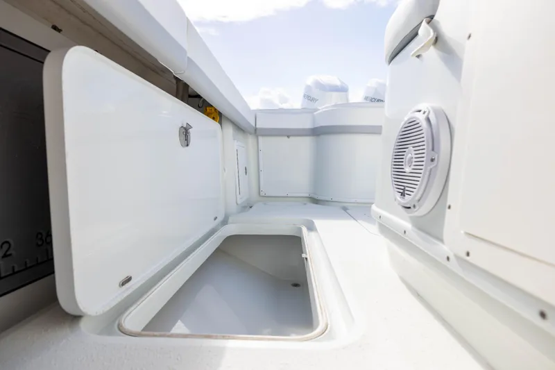 Slide: The Image of 2014 Yellowfin 32 Offshore boat storage compartments and speaker detail. - 25