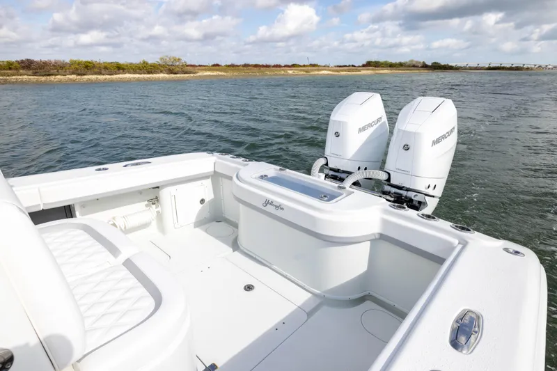Slide: The Image of 2014 Yellowfin 32 Offshore boat with dual Mercury engines on open water. - 29